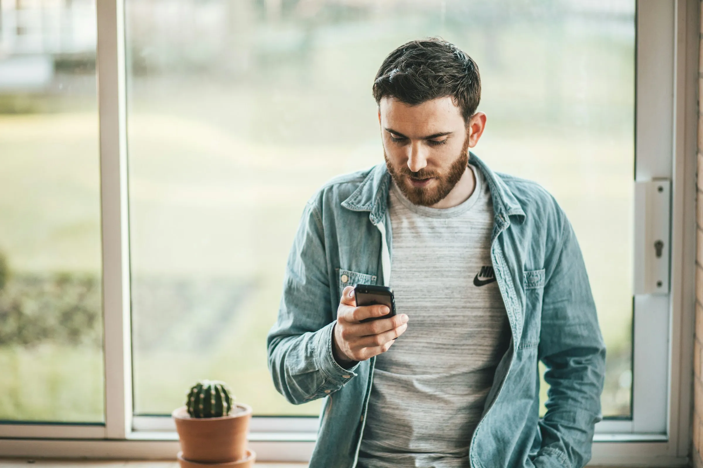 A homeowner on the phone at night with the air conditioning out